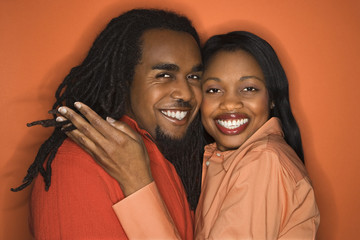 african-american couple wearing orange clothing