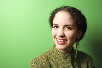 young caucasian woman wearing green clothing.