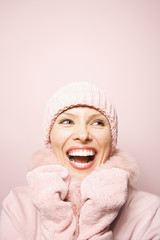 caucasian woman wearing winter coat and hat.