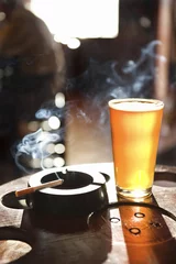  cigratte and pint of beer. © iofoto