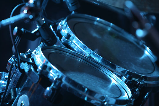 drum set, lit by blue