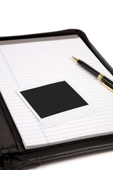  a black padfolio and letter paper