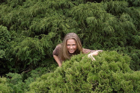 Cute Girl Hiding In Bushes