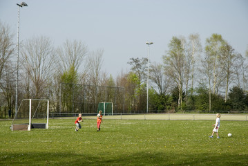 children playing soccer
