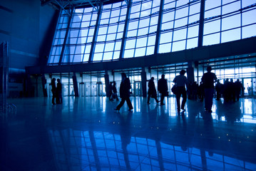 people silhouettes at airport building
