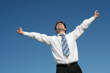 businessman with arms outstretched