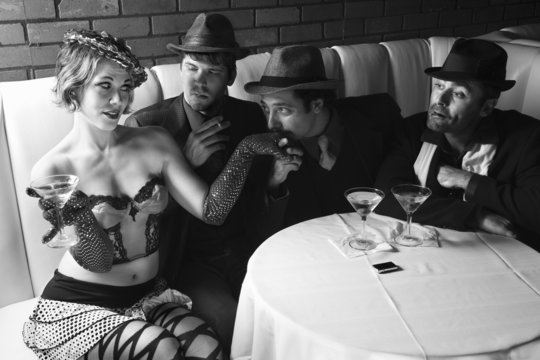 three retro businessmen wooing female.