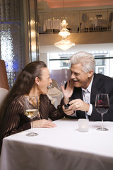 Adult male proposing to female.
