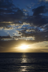 Fototapeta na wymiar Sunset and clouds over ocean.