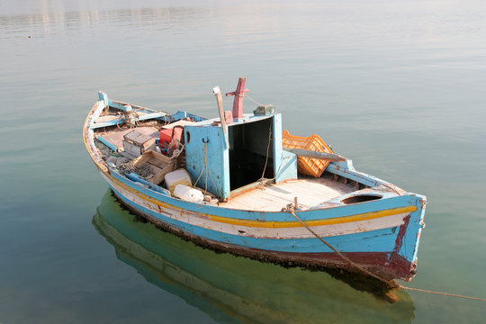 anchored little fishing boat
