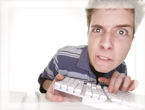 teenage boy frustrated with computer