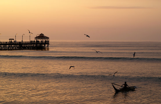 sunset at huanchaco beach in trujillo, per&uacute;
