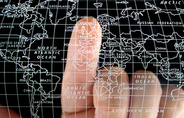 world map finger pointing at uk