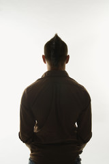 Caucasian man with mohawk.