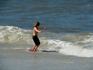 Fototapeta premium young lad surfing