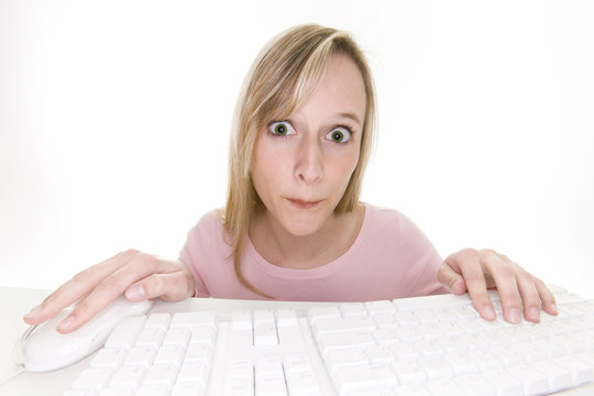 surprised teenage girl using computer