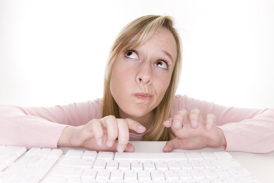 teenage girl thinking using computer