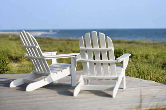 Adirondack chairs overlooking beach on Bald Head Island, North C