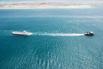 tug towing submarine