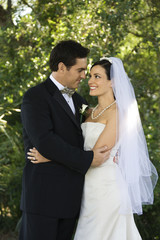Bride and groom embracing.