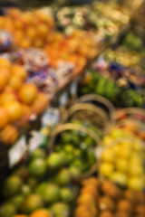 Blurred produce at grocery store.