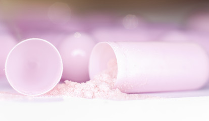 pink capsule and pink powder