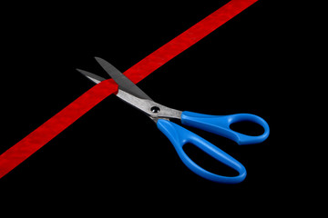 scissors and red ribbon