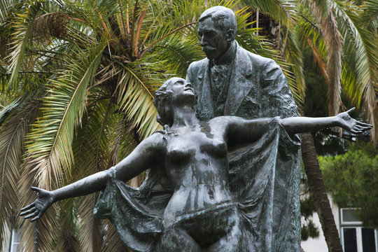 Statue of Eca de Queiros with female in Lisbon, Portugal.