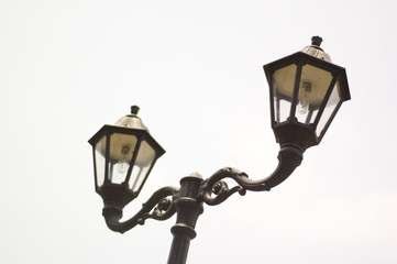 two lampposts in the sky