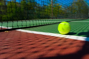Zelfklevend Fotobehang tennis balls on court © Michael Flippo