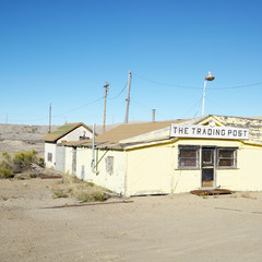 Fototapeta na wymiar old trading post in desert landscape of utah.