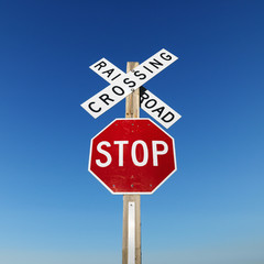 railroad crossing and stop signs.