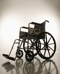 Fototapeta na wymiar empty silhouetted wheelchair.