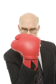 businessman wearing boxing glove.