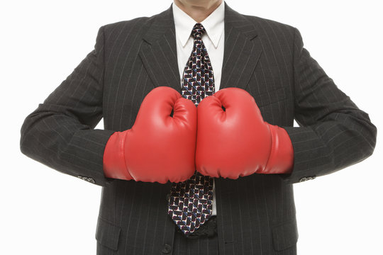businessman wearing boxing gloves.