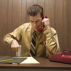 retro business scene of angry man at desk.