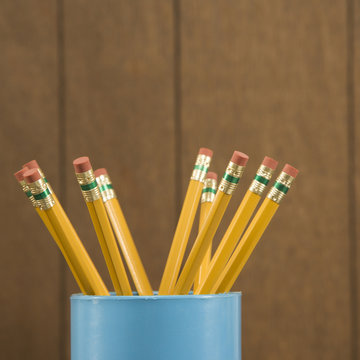 close-up of a cup of wooden pencils.