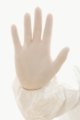 hand wearing rubber glove.