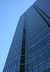 Plakat blue glass-windowed skyscraper