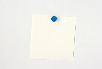 white note pinned to white background
