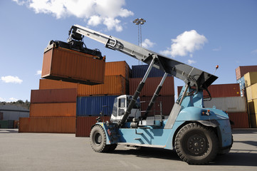 giant forklift stacking containers