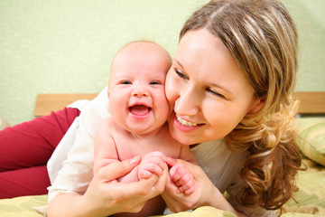 mother with baby in bed 2