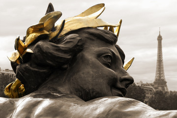 statue head and eiffel tower, paris