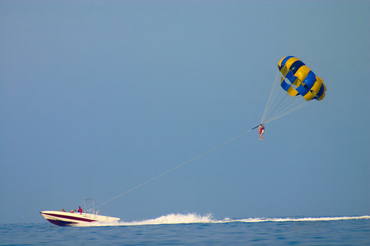 parasailing over sea