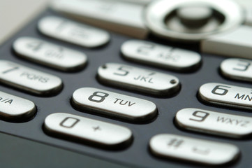 close up shot of mobile keypad under light
