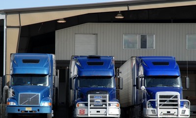blue trucks at loading dock