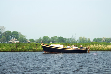 Fototapeta na wymiar a sloop on the river