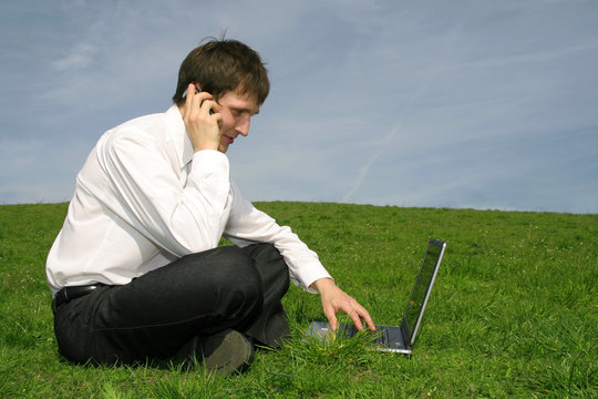 Businessman Using Laptop Outdoors