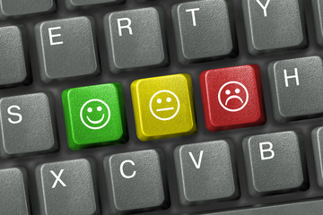 keyboard close-up with three smiley keys