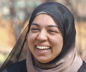 smiling muslim young woman
